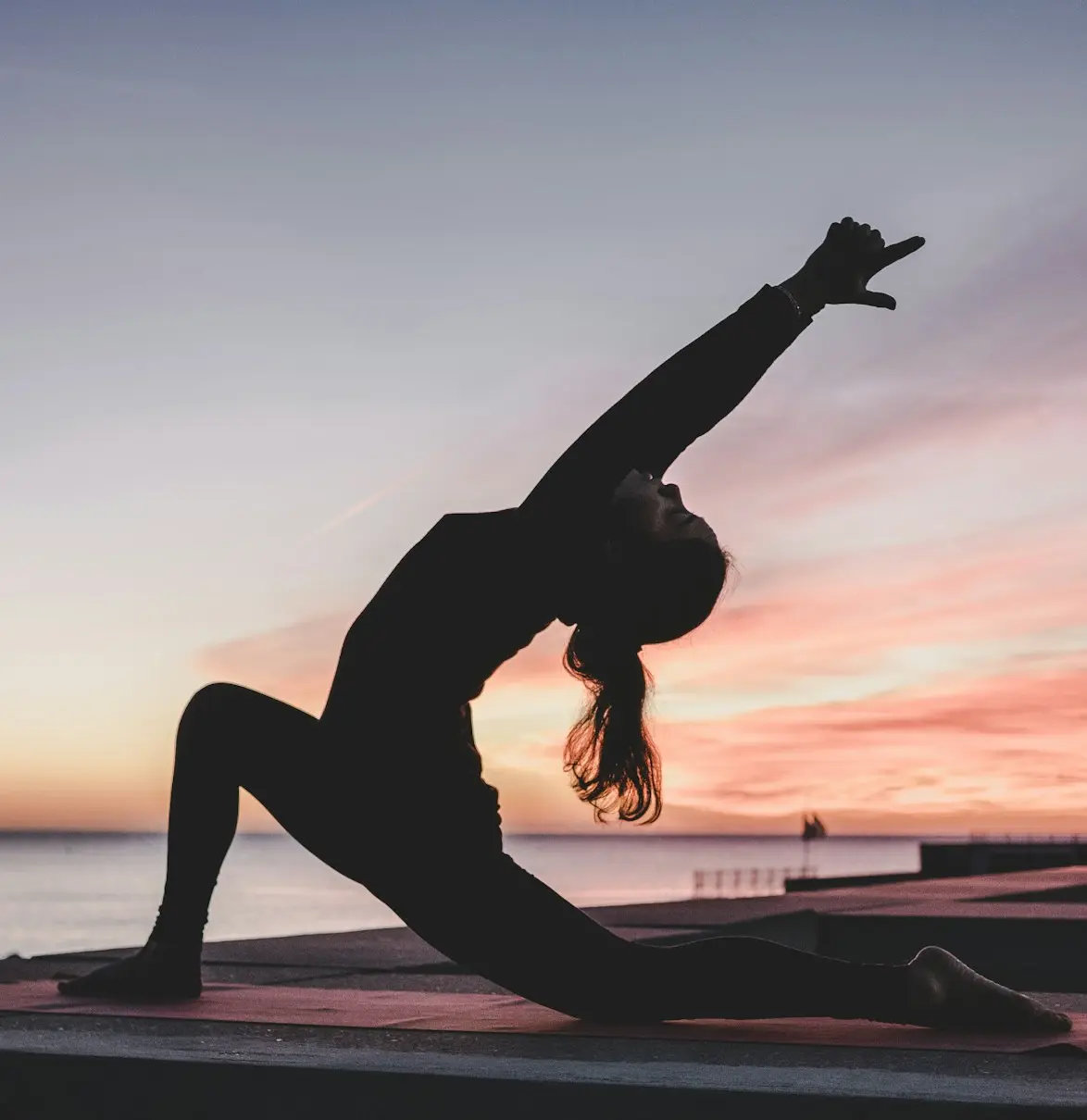 silhouette photography of woman doing yoga